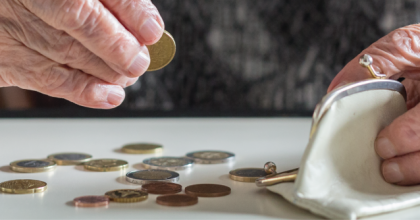 person counting coins