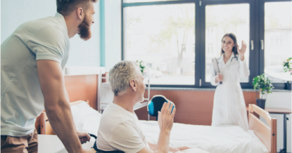 man pushing woman in a wheelchair