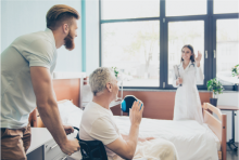 man pushing woman in a wheelchair